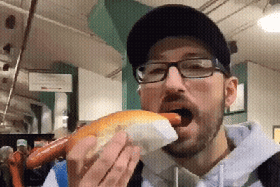 Man With Glasses Eating Hot Dog GIF