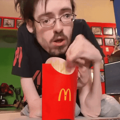 Man With Glasses Eating McDonald's Fries GIF