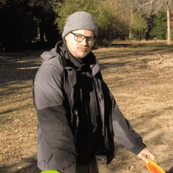 Man With Glasses Enjoying Two Frisbee GIF