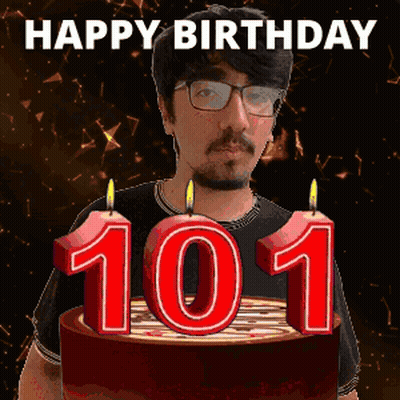 Man With Glasses Holding Birthday Cake With 101 Candles GIF
