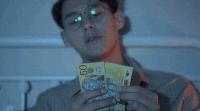Man With Glasses Holding Book Titled Boy GIF
