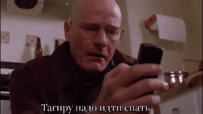 Man With Glasses Holding Cell Phone GIF