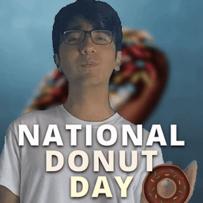 Man With Glasses Holding Donut In Front Of National Donut Day Poster GIF