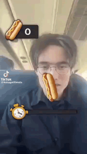 Man With Glasses Holding Hot Dog GIF