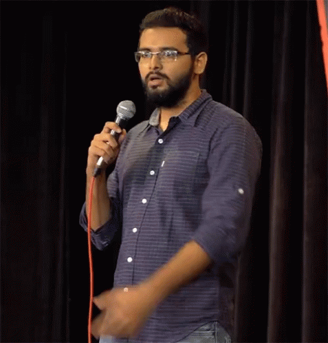 Man With Glasses Holding Microphone GIF
