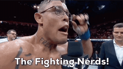 Man With Glasses Holding Microphone Saying Fighting Nerds GIF