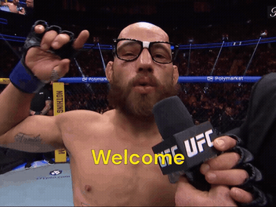 Man With Glasses Holding Microphone Saying Welcome UFC GIF