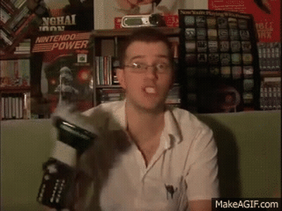 Man With Glasses Holding Nintendo Power Controller GIF