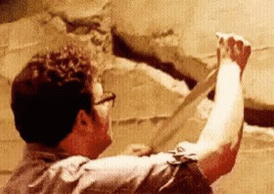 Man With Glasses Holding Paper GIF