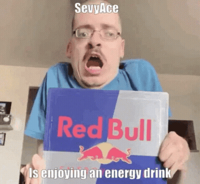 Man With Glasses Holding Red Bull Sign GIF