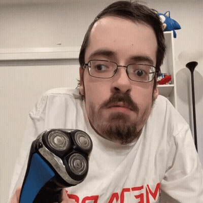 Man With Glasses Holding Shaver GIF