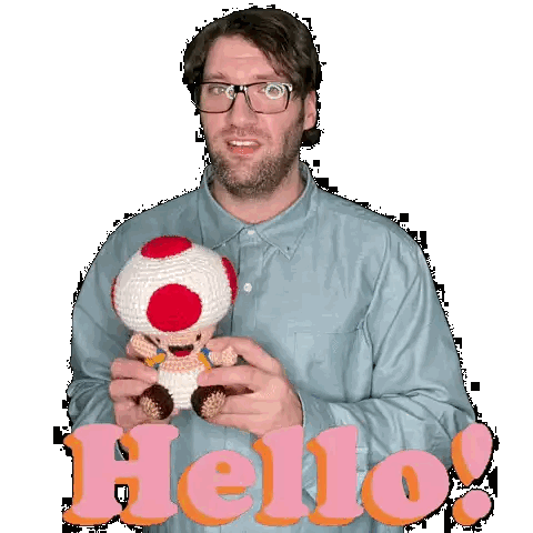 Man With Glasses Holding Stuffed Toad Saying Hello Sticker