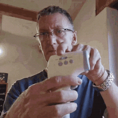 Man With Glasses Holding Thermometer GIF