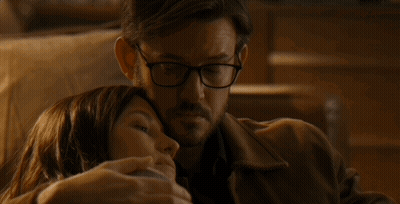 Man With Glasses Hugging Woman Laying On His Chest GIF