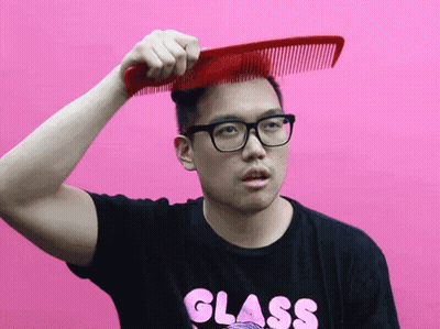 Man With Glasses In Black Shirt Saying Glass Combing Hair GIF