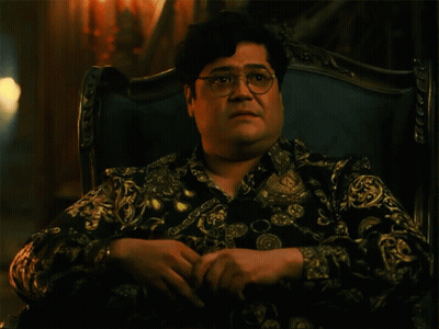 Man With Glasses In Chair Saying Shade GIF
