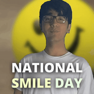 Man With Glasses In Front Of Yellow Smiley National Smile Day GIF