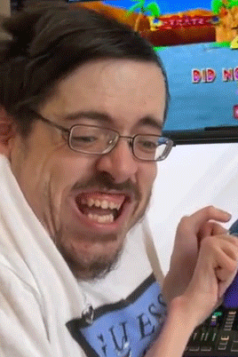 Man With Glasses In Guess Shirt Playing Game GIF