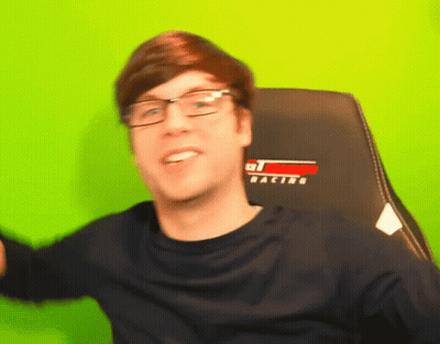 Man With Glasses In Racing Chair GIF
