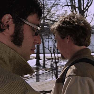 Man With Glasses Looking At Another Man GIF