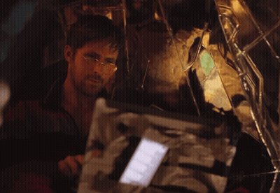 Man With Glasses Looking At Broken Mirror GIF