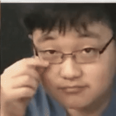 Man With Glasses Looking At Camera GIF
