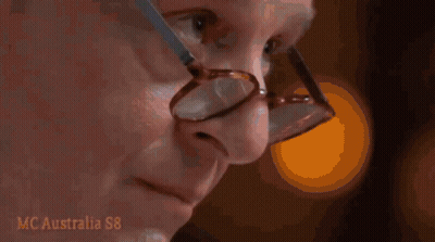 Man With Glasses Looking At Hand GIF