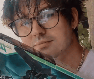 Man With Glasses Looking Out Car Window GIF