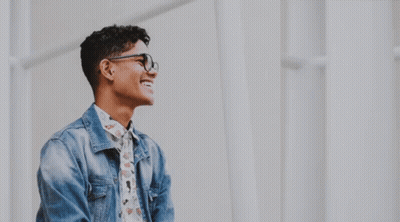 Man With Glasses Looking Through Telescope Smiling GIF