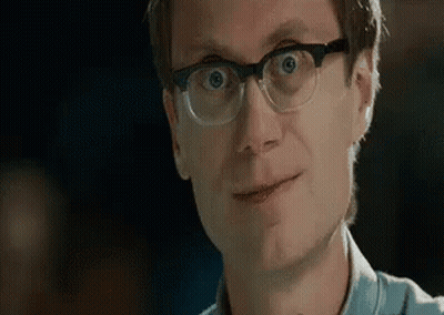 Man With Glasses Making Funny Face And Smiling GIF