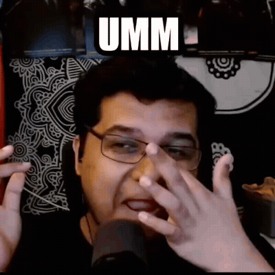 Man With Glasses Making Funny Face At Microphone Saying Umm GIF