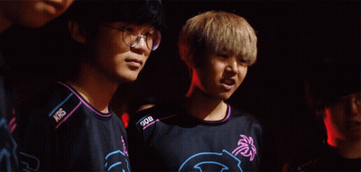 Man With Glasses Next To Man With NBS Shirt GIF