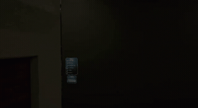 Man With Glasses Peeking From Behind Wall GIF