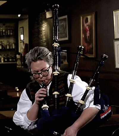 Man With Glasses Playing Bagpipes Saying Scottish GIF