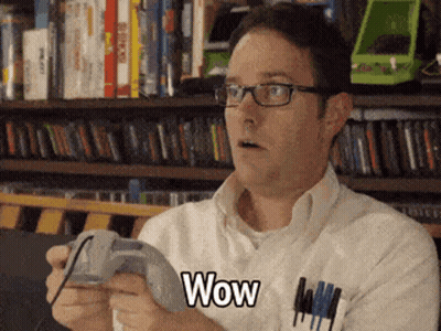 Man With Glasses Playing Game Says Wow GIF