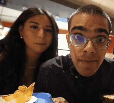 Man With Glasses Posing With Woman GIF