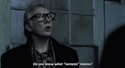 Man With Glasses Saying Do You Know What Nemesis Means GIF