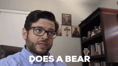 Man With Glasses Saying Does A Bear GIF