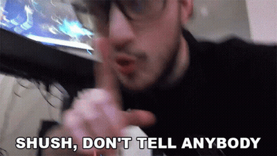 Man With Glasses Saying Shush GIF