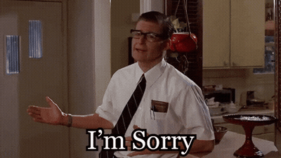 Man With Glasses Saying Sorry In Kitchen GIF