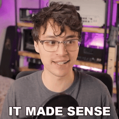 Man With Glasses Says It Made Sense At Microphone GIF