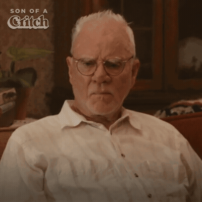 Man With Glasses Says Relax In Front Of Son Of A Gitch Logo GIF