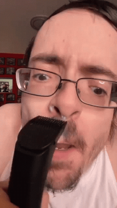 Man With Glasses Shaving His Nose GIF