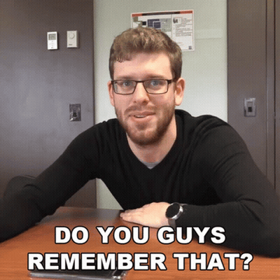 Man With Glasses Sits At Table Saying Do You Guys Remember That GIF