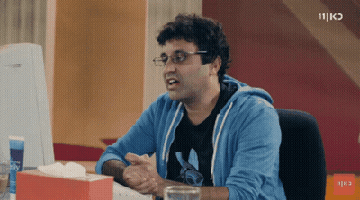 Man With Glasses Sitting At Desk With Tissues GIF