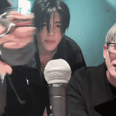 Man With Glasses Sitting At Microphone GIF