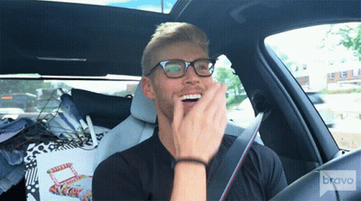 Man With Glasses Sitting In Car With Bravo GIF
