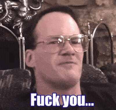 Man With Glasses Sitting In Chair Saying Fuck You GIF