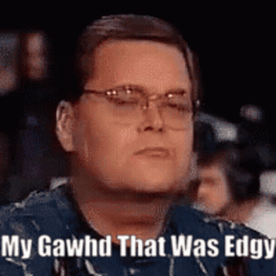 Man With Glasses Sitting In Front Of Crowd GIF