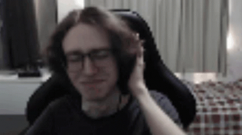 Man With Glasses Sitting Woman Touching Ear GIF